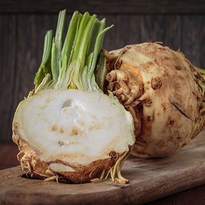 Celeriac Seeds for planting with mature celery root vegetables growing in a home garden
