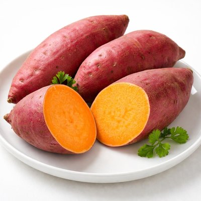 Orange sweet potato vegetable growing in a home garden
